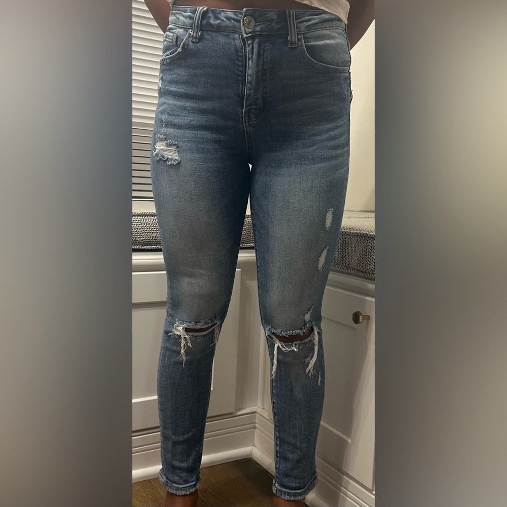 Light wash distressed skinny jeans